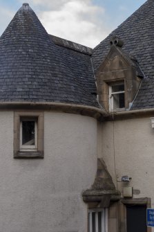 Exterior.  View from south east showing turret and dormer windows.