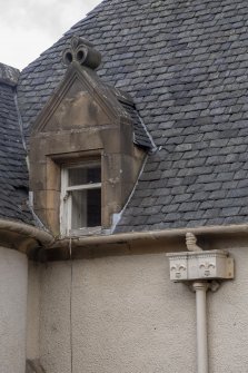 Exterior.  South facade.  View of dormer window and rainwater hopper.