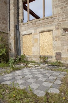 South east elevation. View of draught board and plaque. 