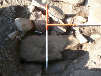 Possible lintel stone and, above, rubble fill of collapse into passage