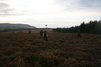 Alison McCaig and Kirsty Millican indicating the line of the east bank of the cursus, from NNE