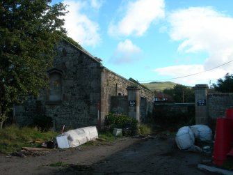 Archaeological evaluation, Stable block W gable end and entrance to yard, The Priory Hotel, Broomfield Place, Largs