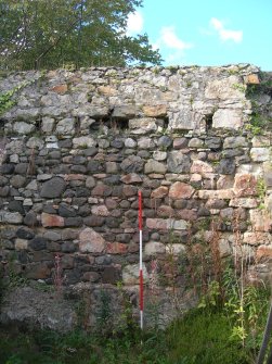 Archaeological evaluation, Stable block, room 1 interior N wall, note beam slots, The Priory Hotel, Broomfield Place, Largs