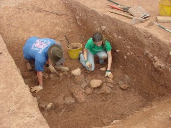 Excavation, Main ditch stony fill, Whittingehame Tower, Traprain Law Environs project Phase 2, East Lothian