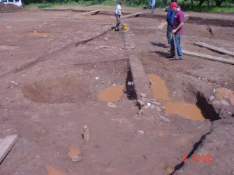 Excavation, Pit complex in wet conditions, Whittingehame Tower, Traprain Law Environs project Phase 2, East Lothian