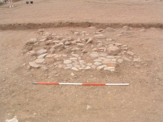 Archaeological excavation, Paving F116, Knowes Farm, Traprain Law Environs Project Phase 2, East Lothian