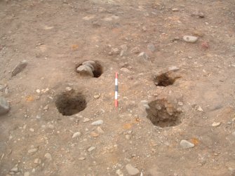 Archaeological excavation, Postholes in scoop F160, Knowes Farm, Traprain Law Environs Project Phase 2, East Lothian