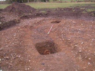 Archaeological evaluation, Curvilinear [5201] slot 2 showing iron object, East Beechwood Farm, Highland