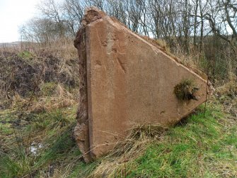 General view of the up-end concrete foundation of a WW2 mast or aerial situated on NW side of aerodrome perimeter.