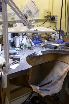 Interior. Third floor. Goldsmiths workshop. View of goldsmiths traditional bench. Note the leather 'apron' below the bench which catches any gold particles that may fall as the goldsmith works.