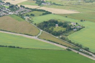 Oblique aerial view of Knockbreck, Tain, Easter Ross, looking N.