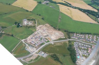 Oblique aerial view of Culduthel Farm development, Inverness, looking SW.