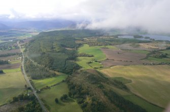 General aerial view  of Tollie, Brahan Wood and Loch Ussie , Black Isle, looking SW.