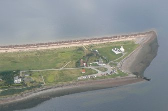 Aerial view of Chanonry Point, Black Isle, looking NE to lighthouse, pier & cottages.