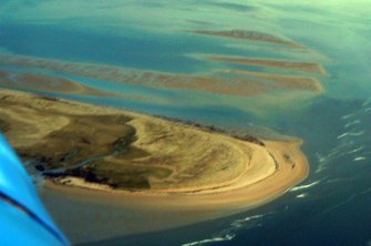 Aerial view of Dornoch Point (airfield and possible coastal defences) and sand banks, looking E.