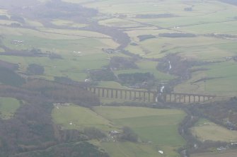 Oblique aerial view of Strathnairn, looking W over Nairn Viaduct, E of Inverness.