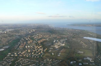 Oblique aerial view of Ninewells Hospital with Dundee and the Firth of Tay beyond, looking E.