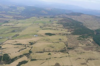 Oblique aerial view, looking W over the Heights of Fodderty in the foreground towards Bottacks in the distance, near Dingwall.