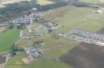 Oblique aerial view of Croy village, E of Inverness, looking SE.