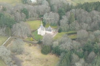 Oblique aerial view of Lickleyhead Castle, Aberdeenshire, looking SE.