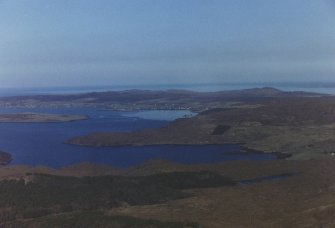 Oblique aerial view of Aultbea, over Cnoc Breac and the Isle of Ewe, Wester Ross, looking NE.