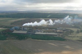 Aerial view of the Norbord wood products factory near Dalcross, E of Inverness, looking S.