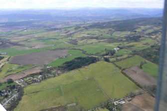 Aerial view of the SW part of Muir of Ord, and the base of the Black Isle, looking S.