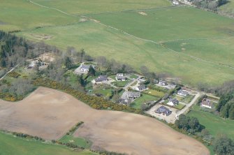 An oblique aerial view of the western extremity of Muir of Ord in Rosshire, looking NW.