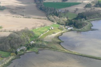 An oblique aerial view of Milton of Redcastle on the northern shore of the Beauly Firth, looking NE.