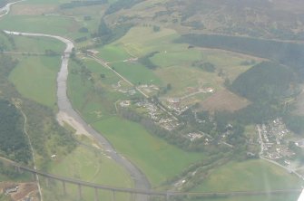 General oblique aerial view of the village of Morilemore/Tomatin in Strathdearn and the Findhorn Railway Viaduct, looking SSW.