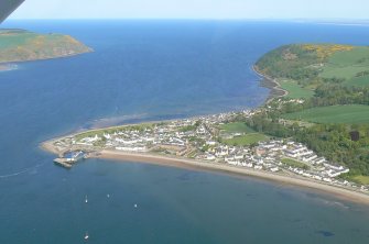 Oblique aerial view, over Cromarty with the headlands of N and S  Sutor in the background, looking NE.