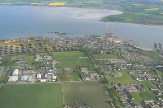 Oblique aerial view of Invergordon with the Cromarty Firth, Harbour and Balblair on the Black Isle, looking S.