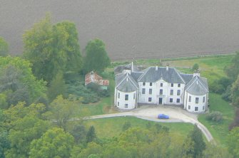 An oblique aerial view of Conan House, near Conon Bridge, Easter Ross, looking NW.