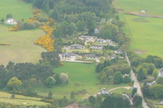 An oblique aerial view of the western extremity of Muir of Ord in Rosshire, looking W.