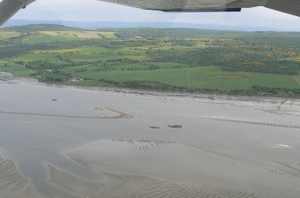 An oblique aerial view of the southern shore of the Beauly Firth, looking SE.