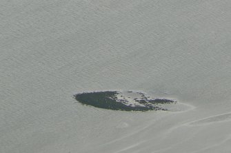 An oblique aerial view of a crannog in the Beauly Firth.