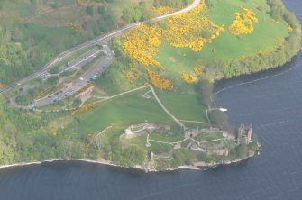 An oblique aerial view of Urquhart Castle, Loch Ness, looking NNW.