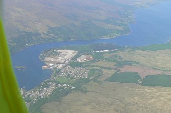 A distant oblique aerial view of Corpach, Fort William, looking SW.