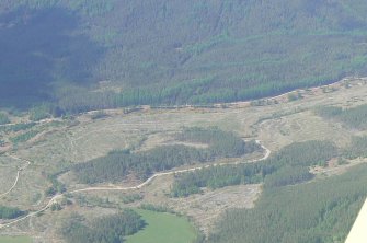 An oblique aerial view of Upper Rogie settlement, and Gleann Sgathaich, near Contin, Easter Ross, looking N.