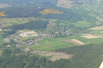 A distant oblique aerial view of Strathpeffer, Easter Ross, looking NE.