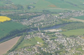 Oblique aerial view of Maryburgh and Conon Bridge, Easter Ross, looking N.