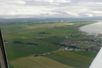 Oblique aerial view of Inverness Airport, looking S.