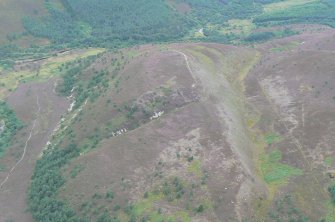 Oblique aerial view of Cnoc an Duin, Strathrory, near Tain, looking W.