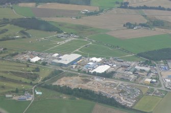 An aerial oblique view of the industrial estate Muir of Ord, Black Isle, looking E.