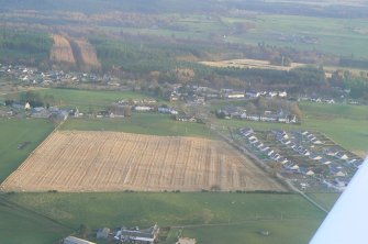 Oblique aerial view of the village of Croy, E of Inverness, looking S.