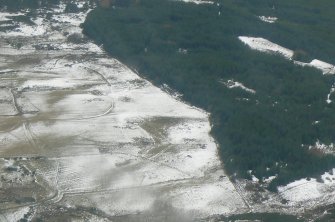 Oblique aerial view of improved croft land above and to the north of the Strath Sgitheach of the River Peffery west of Dingwall, Ross-shire, looking WSW.