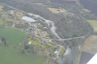 Oblique aerial view of Orrin Bridge and the lower part of the river Orrin, Easter Ross, looking SW.