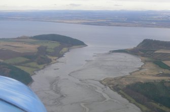 General oblique aerial view of outer part of Munlochy Bay on the Black Isle, Ross-shire, looking SE.