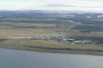 Oblique aerial view of Inverness Airport, looking SE.
