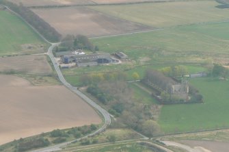 Oblique aerial view of Castle Stewart, Petty, E of Inverness, looking S.